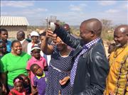 Minister Nomvula Mokonyane with MP Premier David Mabuza share a glass of water from 1 of the new taps in Mathibela Village